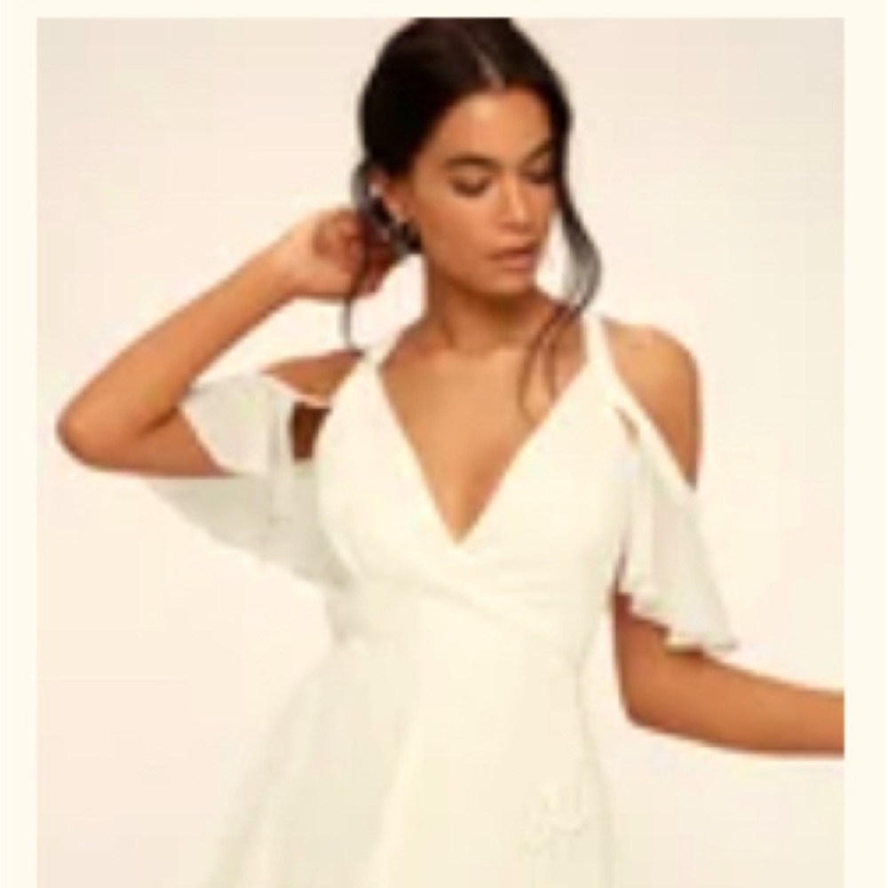 Lulu’s Bombshell white off-shoulder wrap dress.
